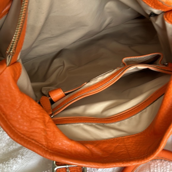 Large leather Cole Haan orange shoulder bag with silver hardware buckles. - Picture 14 of 16